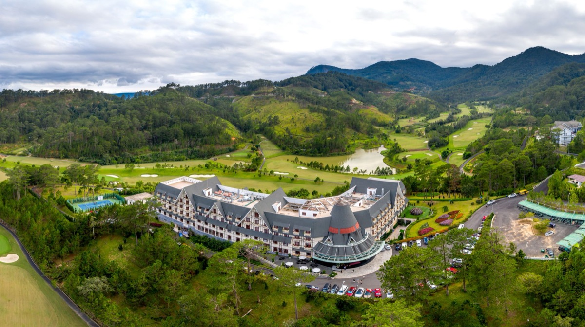 golf course with resort buildings